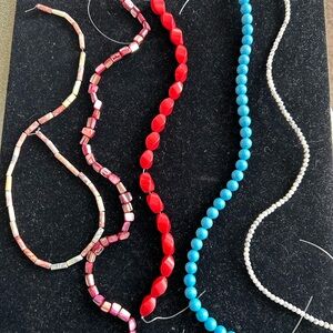 5 strung stone/shell beads